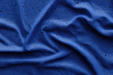 Deep blue fabric with subtle texture and folds