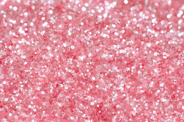 Close-up of shimmering pink glitter, blurred background