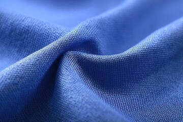 Close-up of textured, blue fabric showing wrinkles and folds