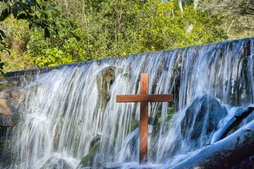 Wooden Cross in a Waterfall