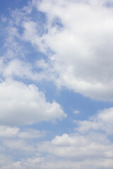 Blue sky with puffy clouds