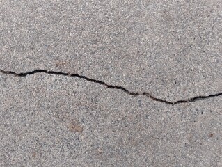 Cracked concrete surface urban environment photography close-up view structural integrity concept