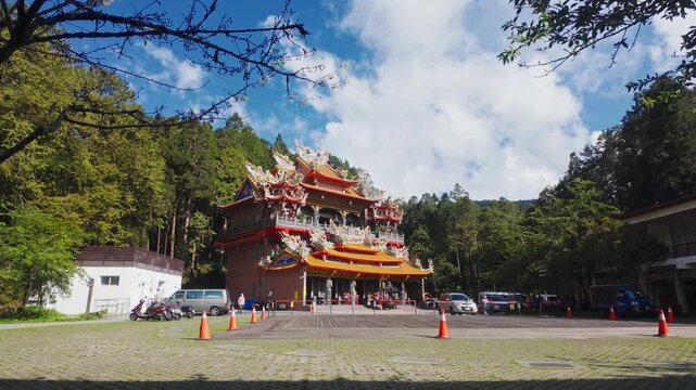 Profile view of Alishan Shouzhen Temple on broad daylight with lush greenery at background in Taiwan.