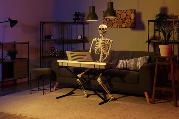Human skeleton model with synthesizer in dark living room