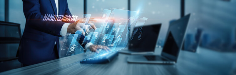 Nanotechnology concept. Hand touching nanoscale material innovation systems, research connection on virtual screen particle engineering sensors medicine automation, and microscopic manipulation.