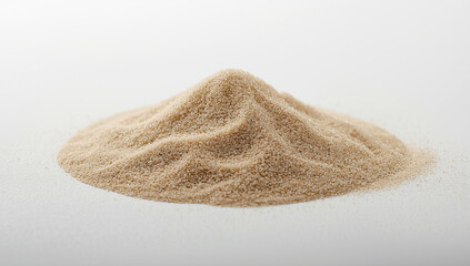 Fototapeta premium Pile of Light Brown Sand on a White Surface, Close-Up
