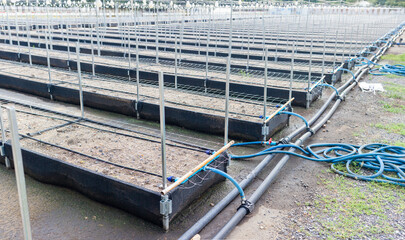 Close-up of an agricultural water management infrastructure system with pipes and valves. Modern agriculture. Maintenance of agricultural irrigation systems.
