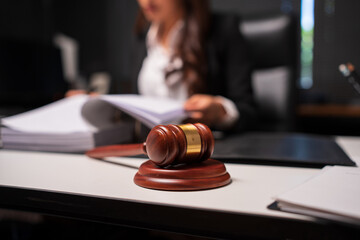 Female lawyer is working on legal documents in an office.	
