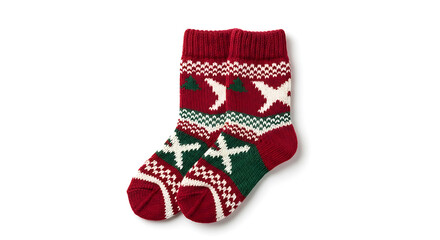 A pair of christmas socks with red white and green patterns on a plain white surface in a studio shot