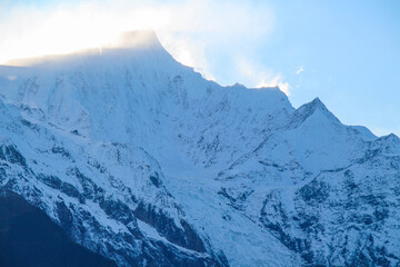 Jagged, snowy peaks loom under a cloudy sky
Yala Snow Mountain, Sichuan, China
