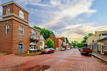 The historic 18th century Main Street through the brick paved old town of St. Charles, Missouri, along the Missouri River.