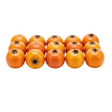 Tejocotes arranged in a neat pattern, highlighting their distinct shape and color for culinary or decorative use