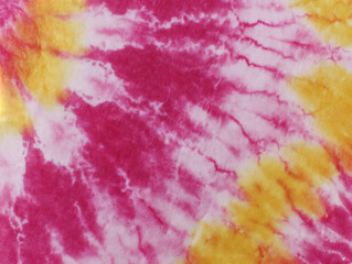 Abstract tie-dye fabric with vibrant hues