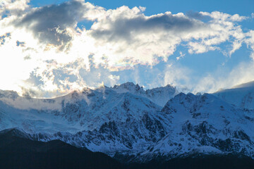 Jagged, snowy peaks loom under a cloudy sky
Yala Snow Mountain, Sichuan, China