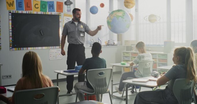 TSA Security Officer Explaining Safety Rules to Young Students at Elementary School Classroom. Children Asking Questions, Listening to Police Worker Guidance About Knowledge of Law and Responsibility.