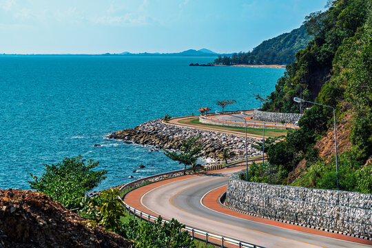 Beautiful seascape viewpoint of the winding road along sea. Viewpoint and beautiful landmark of Noen Nang Phaya at Kung Wiman Bay in Chanthaburi Thailand. Beautiful scenic coastal road sea landscape.