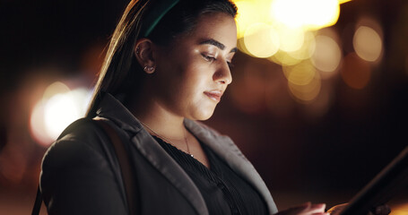 Woman, tablet and night in city for trip, direction or booking taxi with bokeh on urban commute. Business person, tech and chat in town, contact and notification with social network app in Mexico