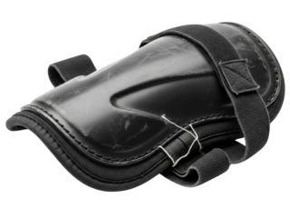 Worn black plastic protective sports shin guard with straps on a transparent background