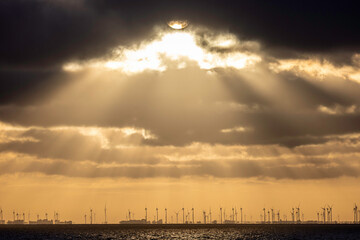 Germany. Elbe River Estuary (the mouth of the Elbe), view from west bank of 17 km wide estuary, wind farms in the background