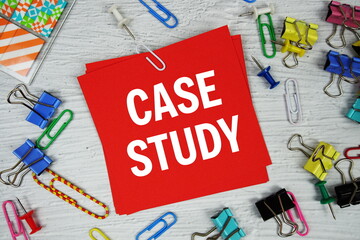 Case Study text on stick note with stationery on concrete background