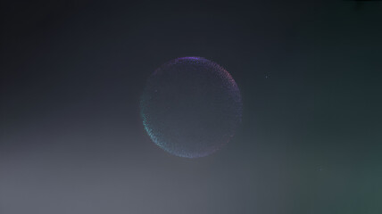Abstract glowing sphere with particles floating in a dark, smoky atmosphere