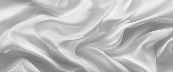 Fototapeta premium Smooth, flowing white fabric. A close-up view of a white fabric with soft, elegant folds and drapes. The light reflects subtly across the surface creating a sense of luxurious texture