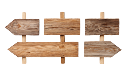 Four weathered wooden directional signs, arranged in a grid pattern