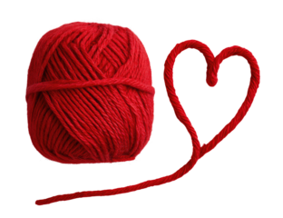 A vibrant red ball of yarn beside a heart-shaped strand