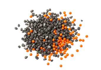 Extreme macro shot of irregular charcoal grey iron filings and distinct bright orange plastic granules scattered on a transparent background, concept of industrial remnants