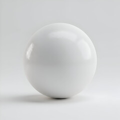 A glossy, white sphere rests on a plain, light gray surface. A simple, elegant object for a minimalist design project.