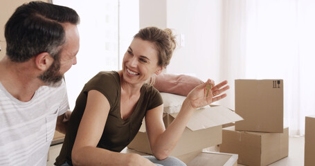 Moving in, couple and happy with keys in new home for property purchase, relocation and investment....
