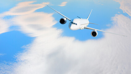 White passenger airplane flying in the sky amazing clouds in the background - An airplane shakes during turbulence flying air hole - A plane spinning in round clouds - Front view of an airplane 