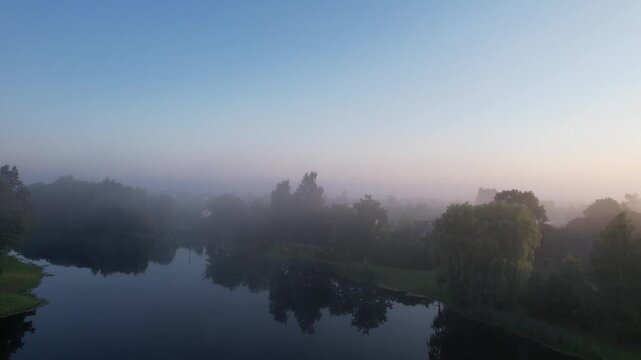 Church in the fog dawn in Krakes Lithuania