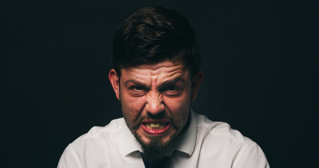 Businessman, portrait and stress with depression in studio, financial crisis and space on black background. Person, sad and frustrated with mental health, anxiety or anger for bankruptcy in Spain