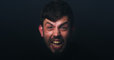 Anger, scream and portrait of man in studio for psychology, panic and schizophrenia symptoms. Fear,...