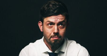 Businessman, sad and thinking with depression in studio, financial crisis and space on black...