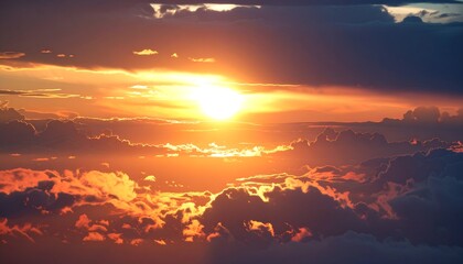 A vibrant sunset viewed from above the clouds