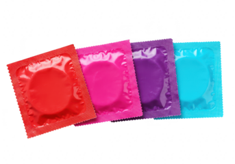 Four colorful condoms in wrappers red, pink, purple, and teal, isolated on transparent background
