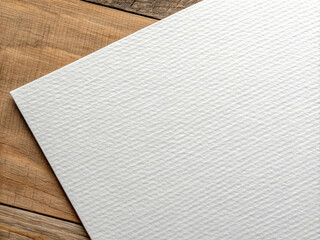 White Textured Watercolor Paper on a Wooden Desk