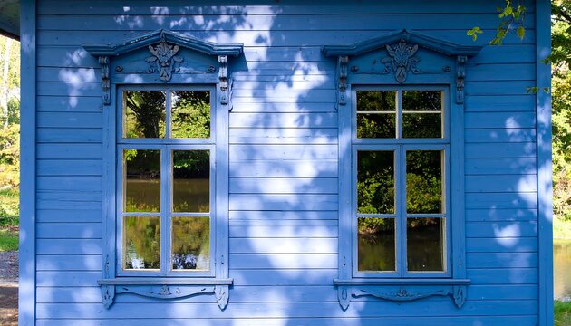 Rustic blue house with ornate windows - Powered by Adobe