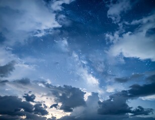 Obraz premium Night sky, clouds, and stars