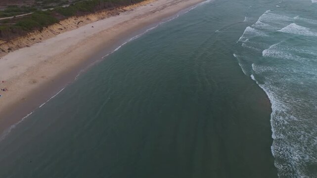 aerial of maceda beach in s pedro ovar portugal with soft waves washing the sandy coast