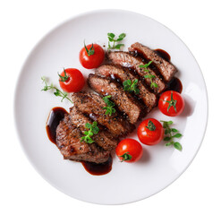 Sliced steak with cherry tomatoes and herbs on a plate
