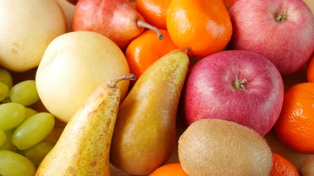 Composition of various fresh fruits gradually appearing, including apples, pears, bananas, grapes, pomegranates, and more.