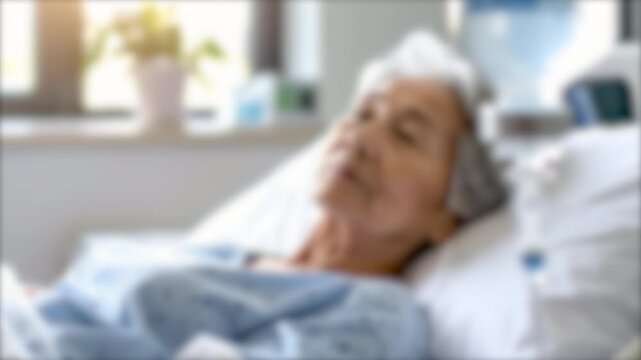 ぼかし背景素材: 入院中のシニア女性  病院のベッドに横たわり病気の治療を受ける高齢者のイメージ