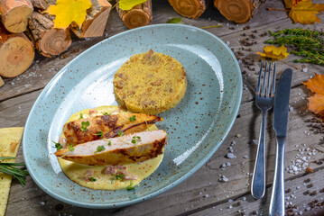 Couscous with chicken fillet on a plate