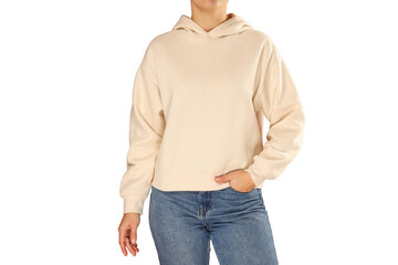 Woman poses in a stylish beige hoodie and jeans, isolated on white, PNG