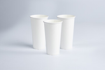 Three stacked 20 oz paper cups on a white background.