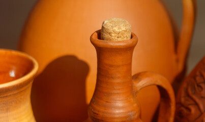Brown vase with a cork stopper on top