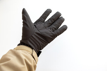 黒の手袋をはめた手	